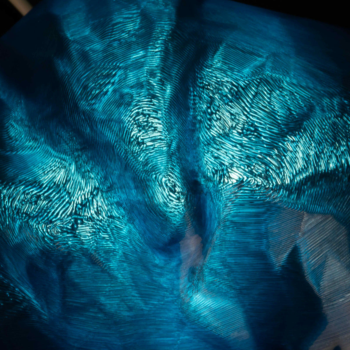 Close up of blue croissant lamp
