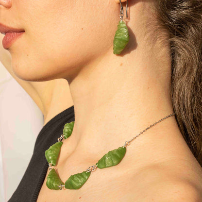 cute, statement collar necklace. silver stainless steal. hemp green color. croissant shaped. sustainable locally made nacklace