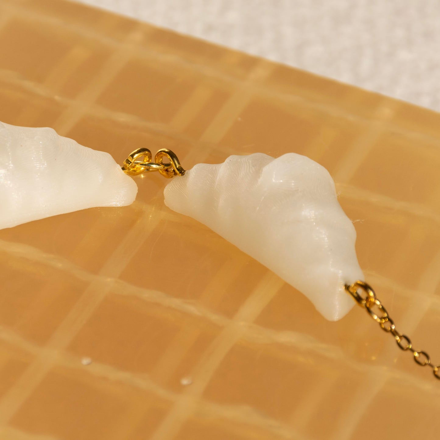 cute, statement collar necklace. gold stainless steal. seashell white color. croissant shaped